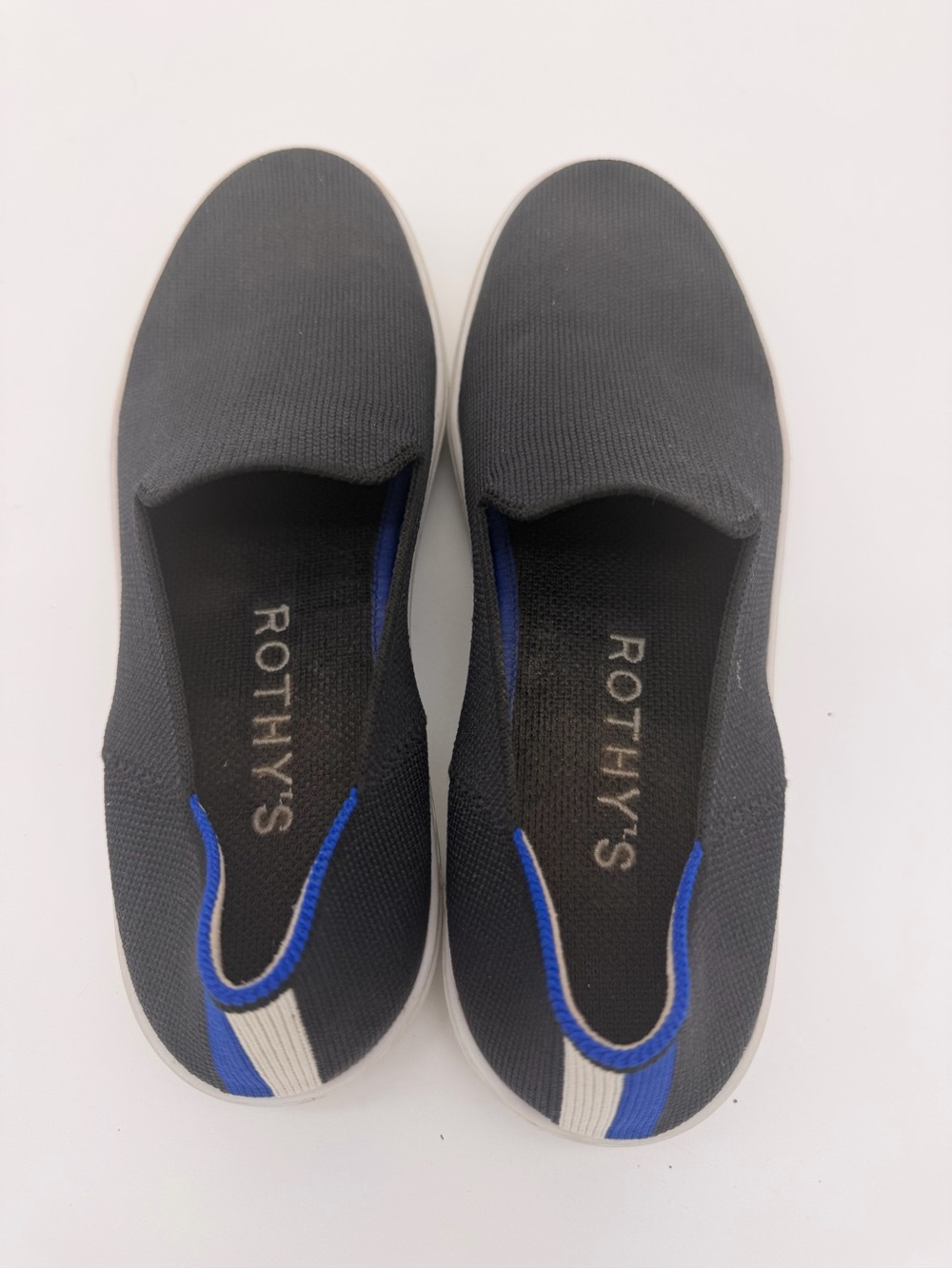 Rothy's Women’s Original Black Slip-On Sneakers with Blue Accents size 8.5.
